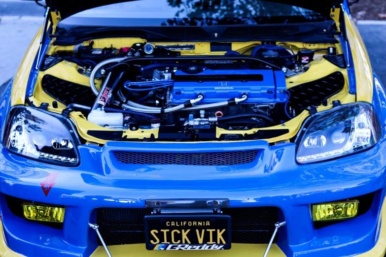 the front end of a blue honda civic