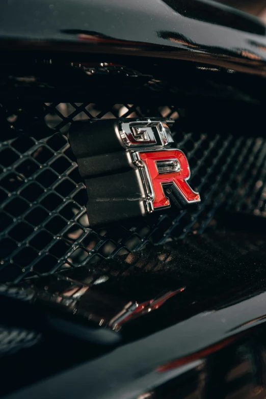 close up view of a ra badge on a car