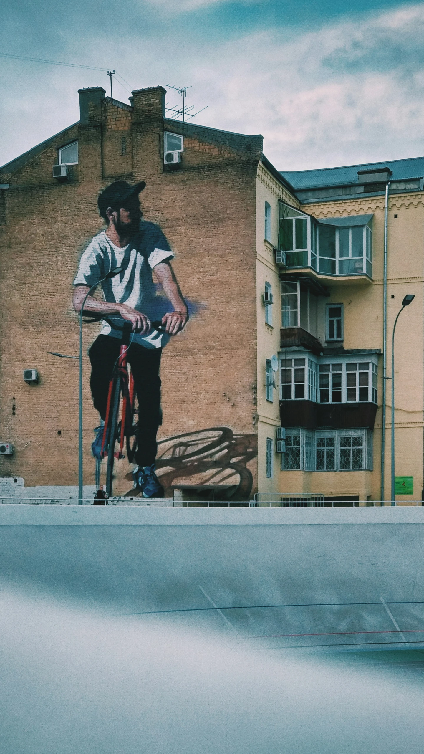 a man is doing skateboard tricks near an old building