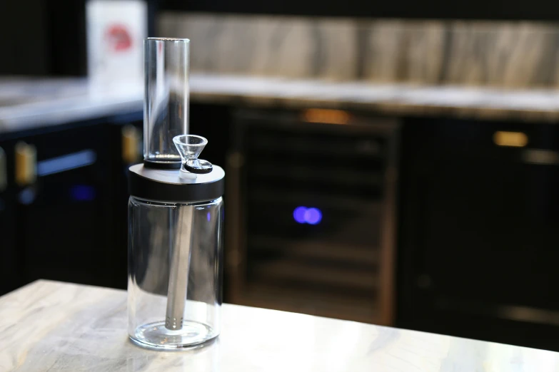 a glass is shown on a counter top