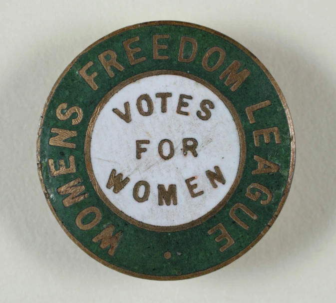 a wall mounted ceramic sign depicting women's election