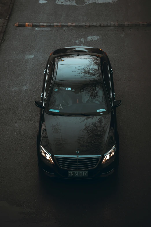 car parked on asphalt in parking lot with no one