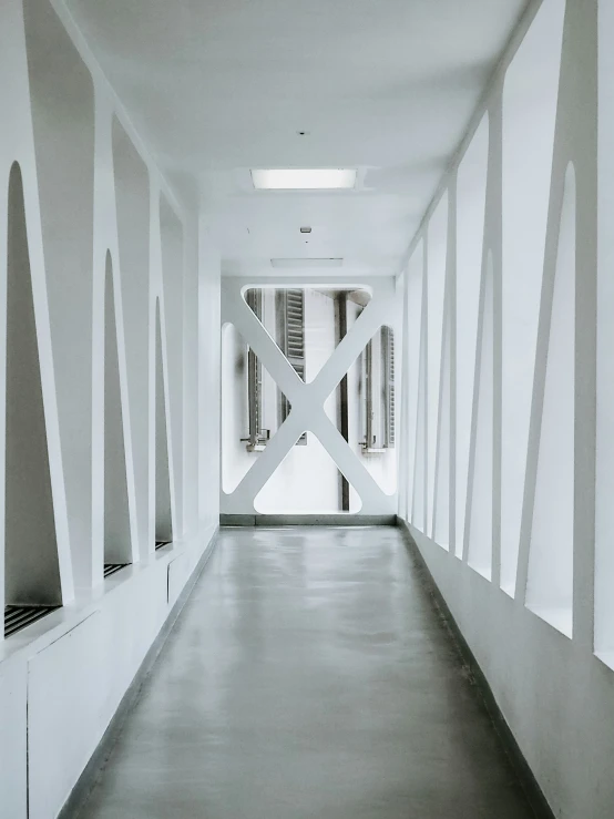 this is a long hallway with a long white striped wall