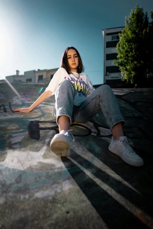 a woman posing on a skateboard with her skate board