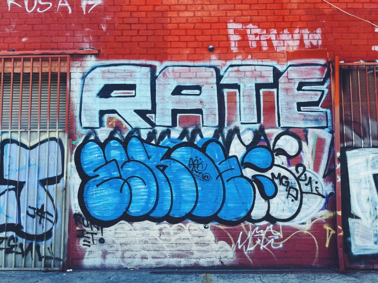 some grafitti on a brick building in the city