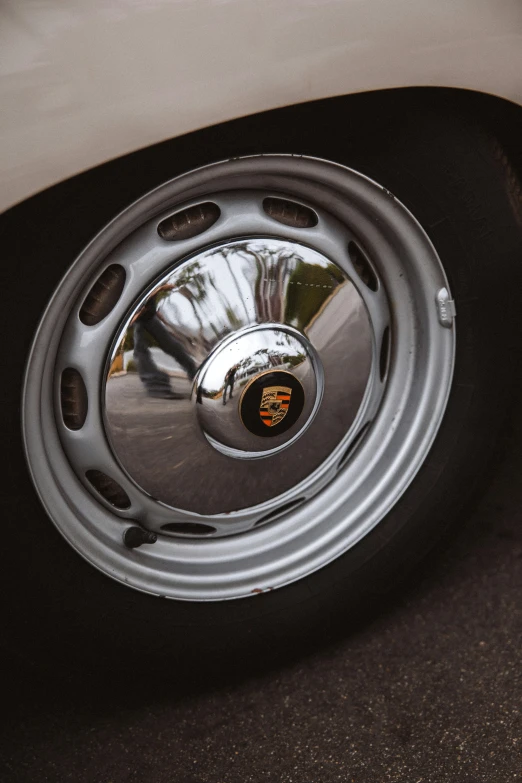 the reflection in the wheels on a car's shiny chrome spokes