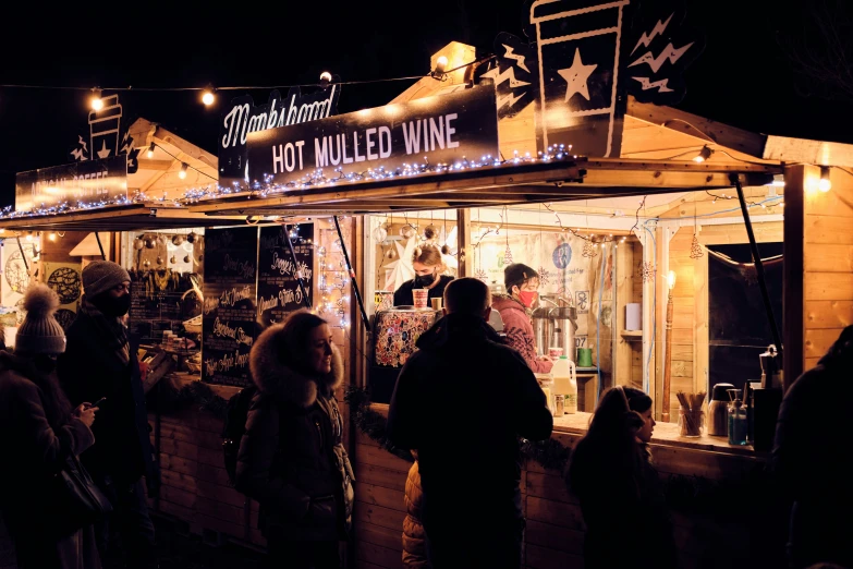 many people are standing in line for food at night