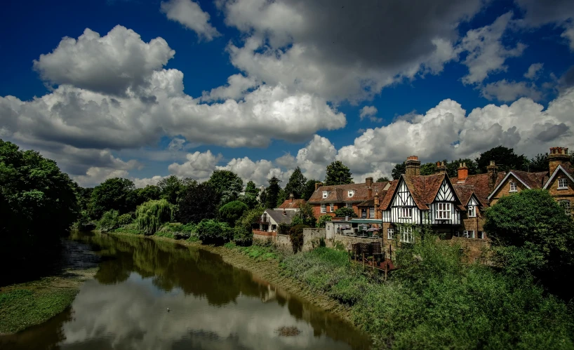 a picture of a river next to houses