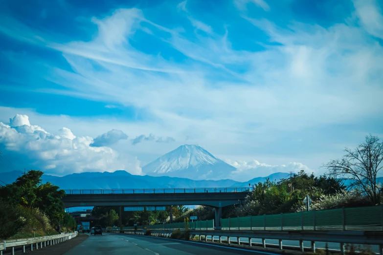 the view is of a highway near a volcano