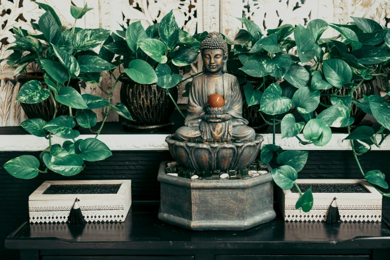 small statues sit on top of a desk