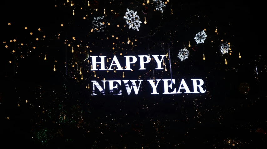 the words happy new year with many lights