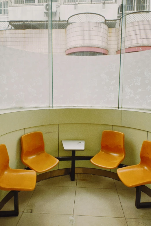 three chairs in front of a window with some windows