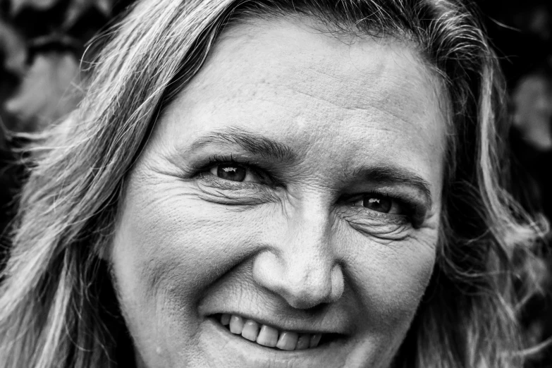 a black and white po of a smiling woman