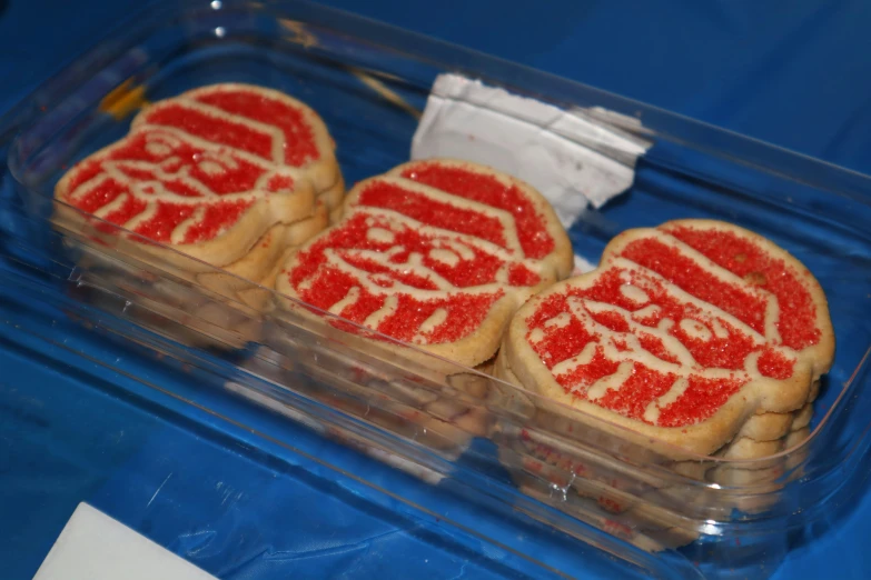 several cookies are placed together in a clear box