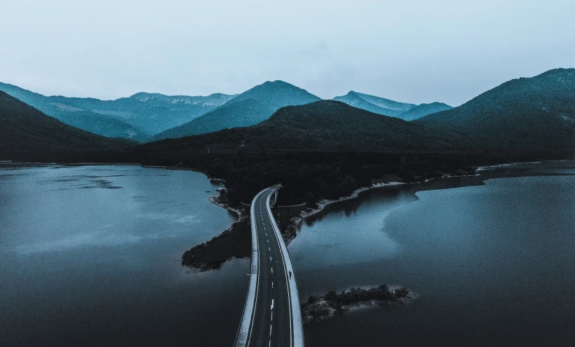 a road that is running through the mountains