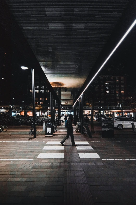 the crosswalk in the dark of night has street lights