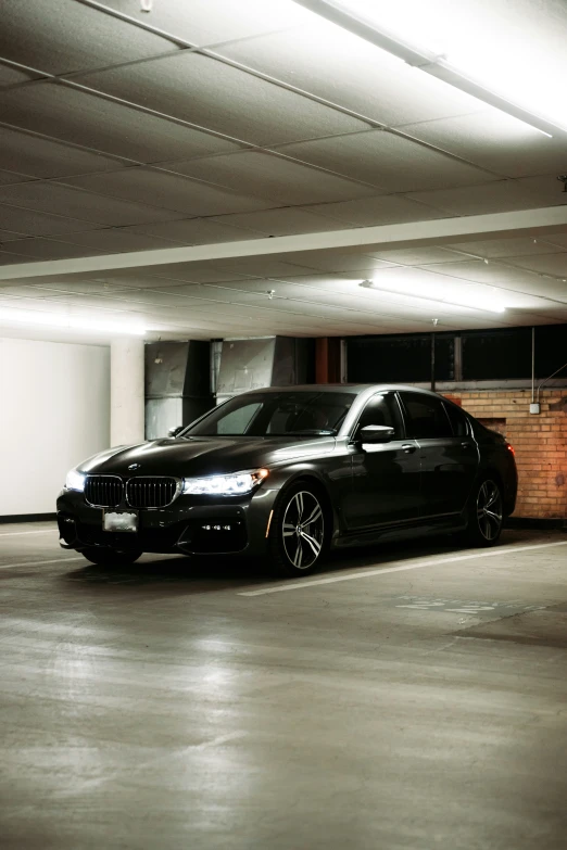 two cars parked next to each other in a car parking garage