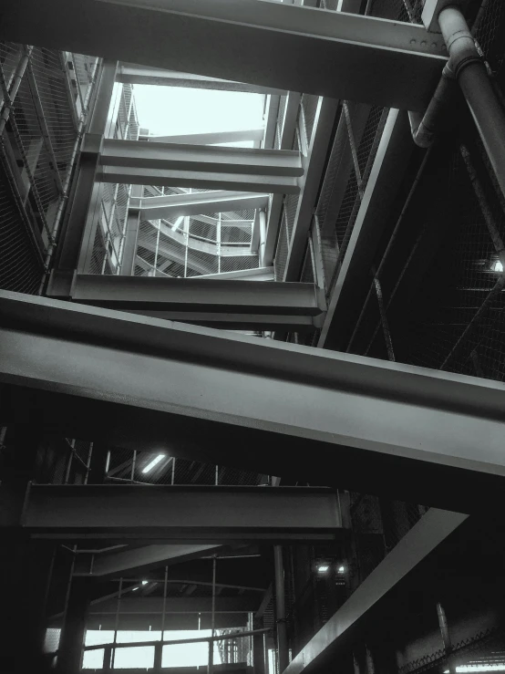 a man is walking on a stairwell in a building