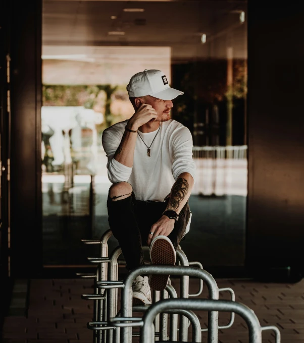 a guy sitting at the end of a bench