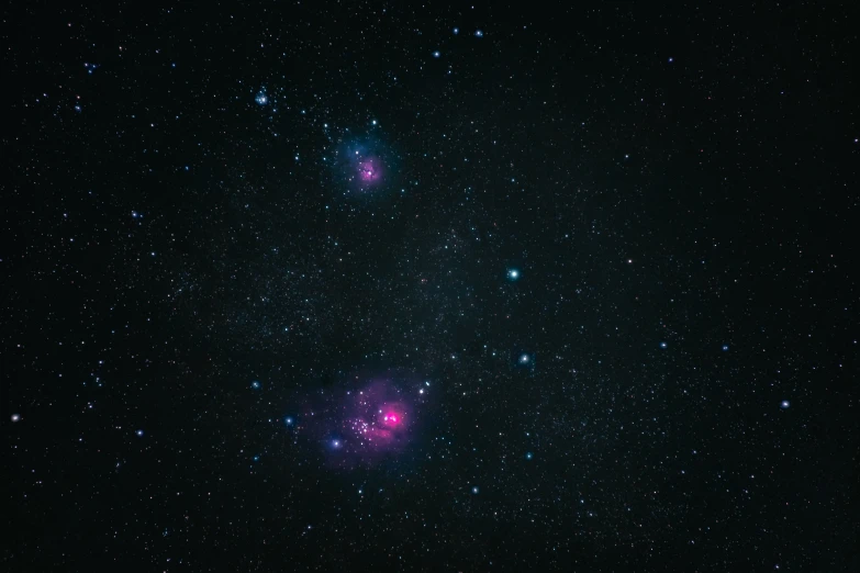 a star cluster is shown with bright blue stars