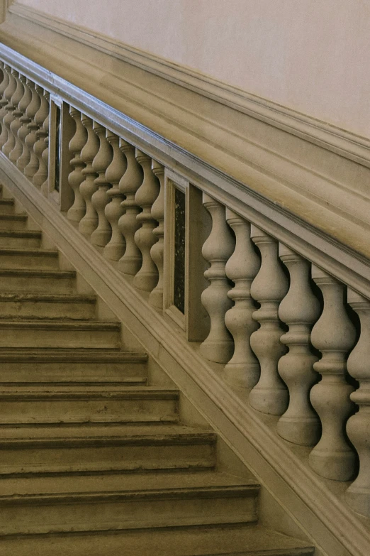 a view of a staircase of a building with columns