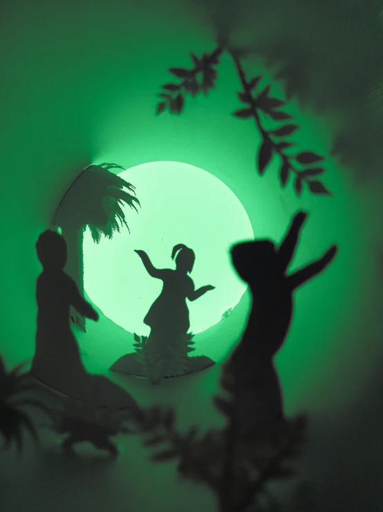 silhouettes of children running in a room at night