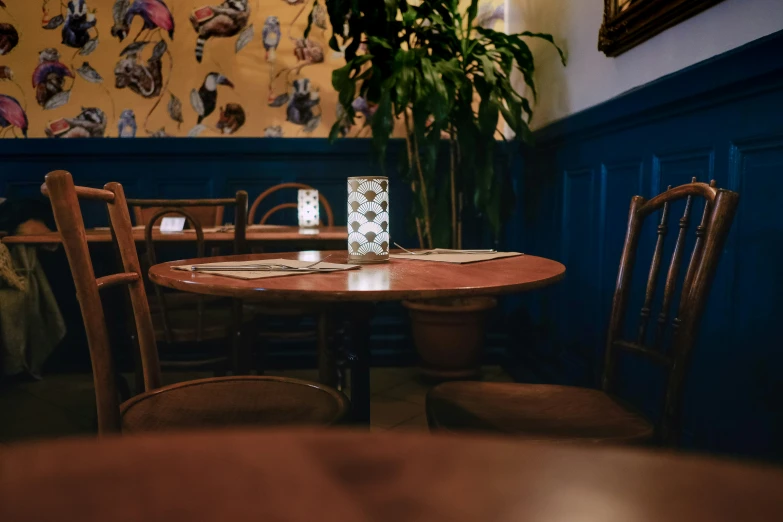 a small table in the corner with chairs