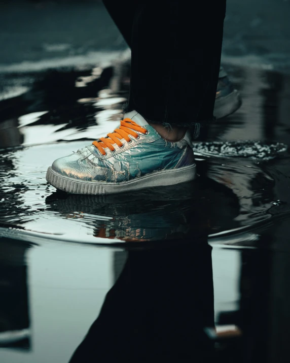 a person standing on a dle with their feet in the water