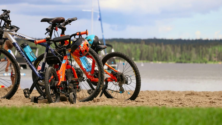 two bicycle that are sitting in the dirt