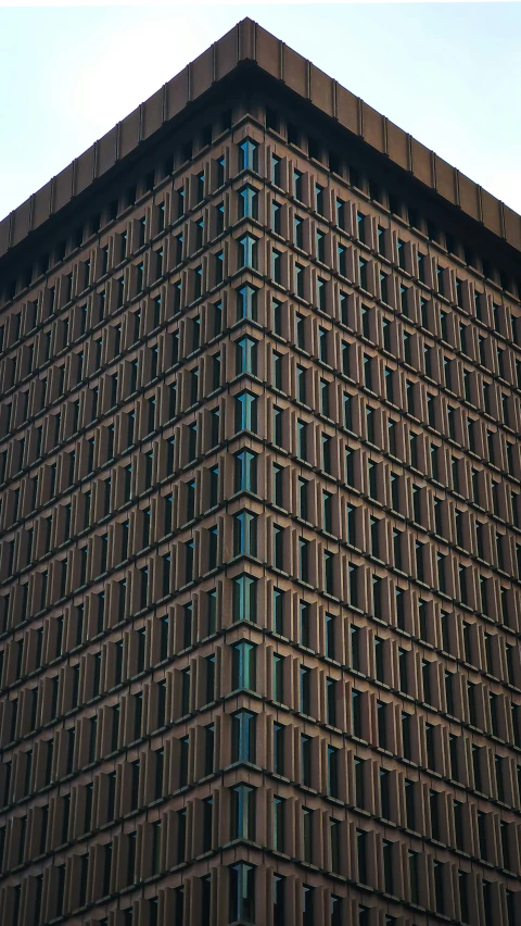 the exterior of a tall building that's made up of many windows