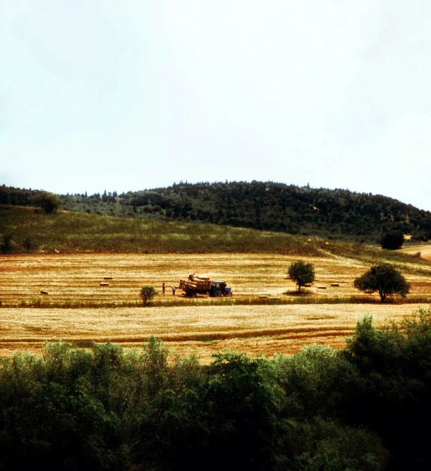 an empty field that is next to a hill