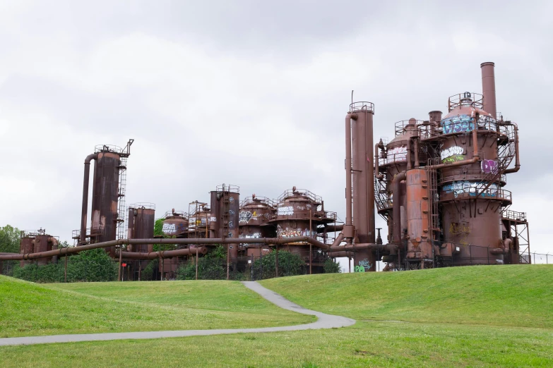 a large factory with lots of industrial pipes on it's side