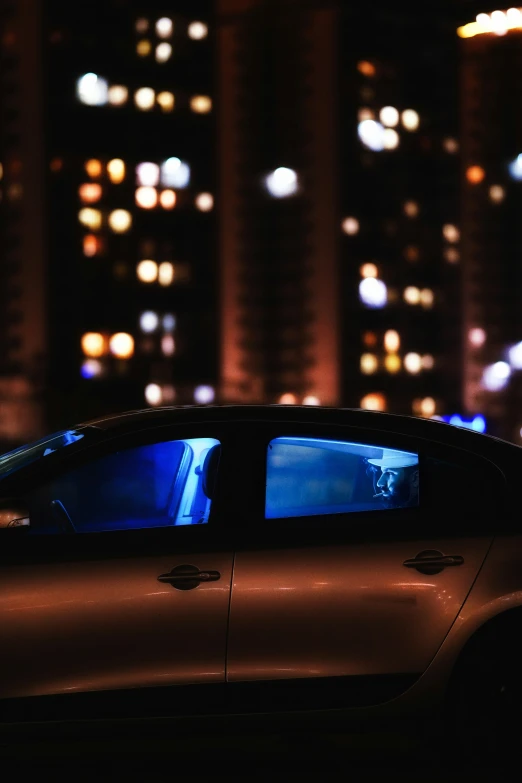 night city view of buildings with illuminated cars