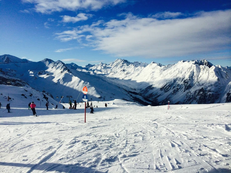 many skiers on a snowy mountain on ski's