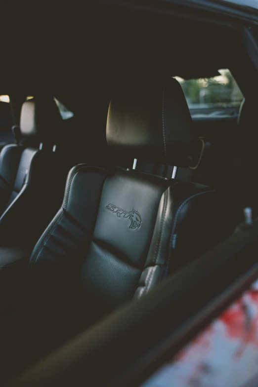 a po of a black car seat and a black and white seat