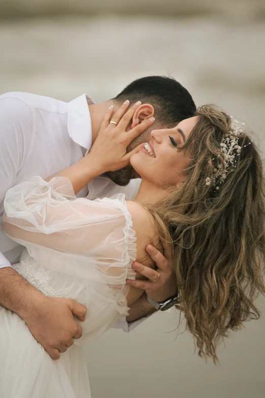 the bride and groom are hugging at their wedding