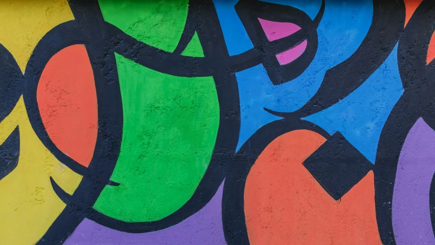 colorful graffiti on the side of a building with many circles