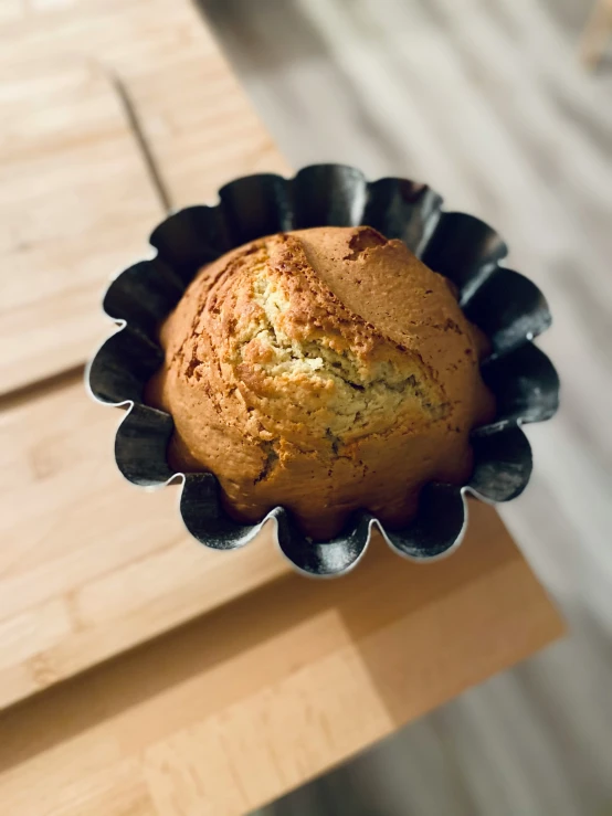 a close up view of a muffin in a tin