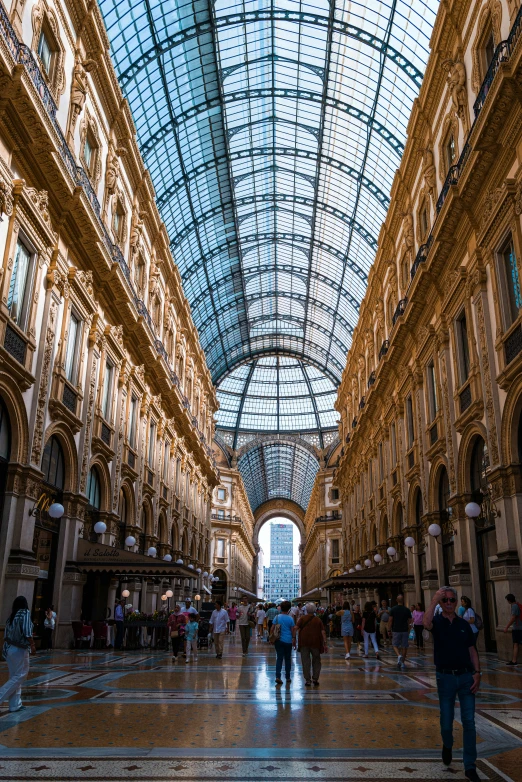 an arcade with a big glass ceiling in a building