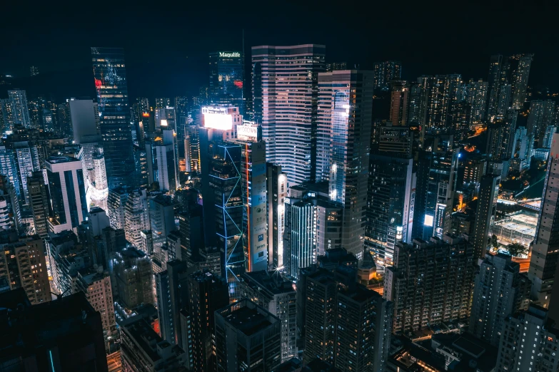 a nighttime city skyline filled with tall buildings