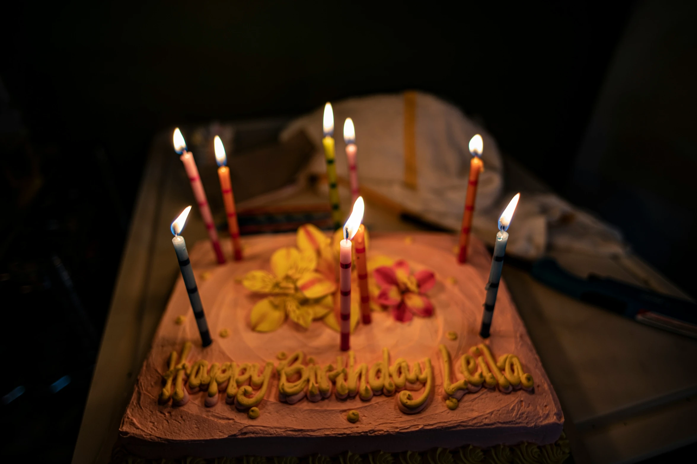 a cake with candles for a happy birthday