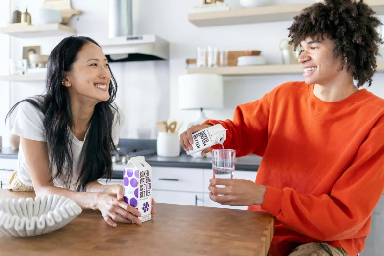 two women at the kitchen table one is pouring soing out