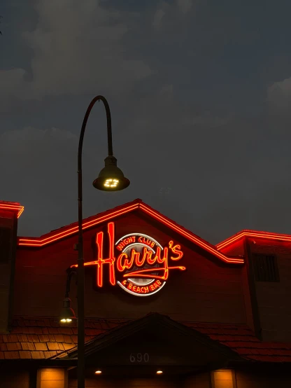 a restaurant has many bright red lights over it