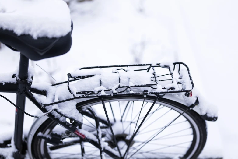 a bike that is covered in snow on the street