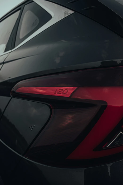 the front view of a red and black sports car