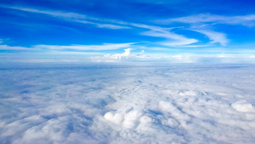 the clouds are fluffy over the sky