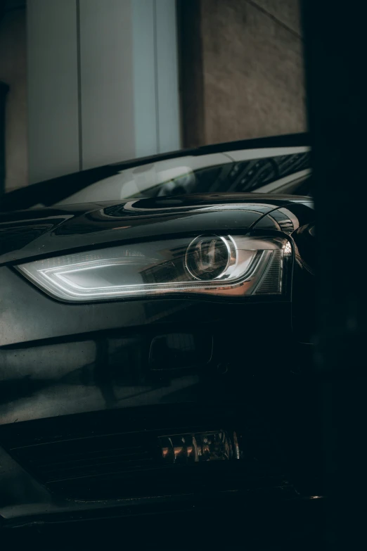 the front lights of an suv parked in a driveway