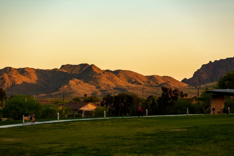 a field with mountains in the background