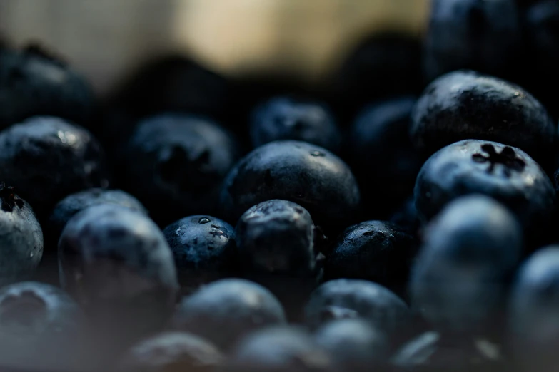 some blueberries are sitting together on a table