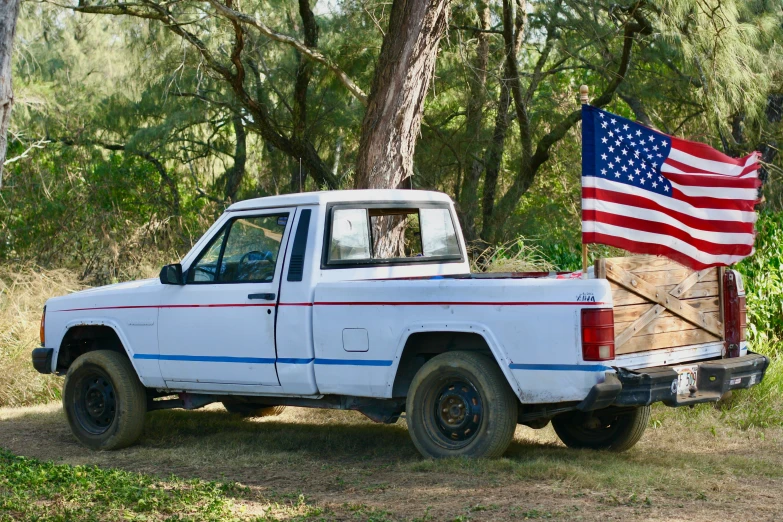 a truck with a us flag in the back